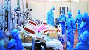 Nurses and health workers attend critical covid positive patients inside an ICU facility run by Navi Mumbai Municipal Corporation during the second wave of the pandemic. (Express Photo by Amit Chakravarty)